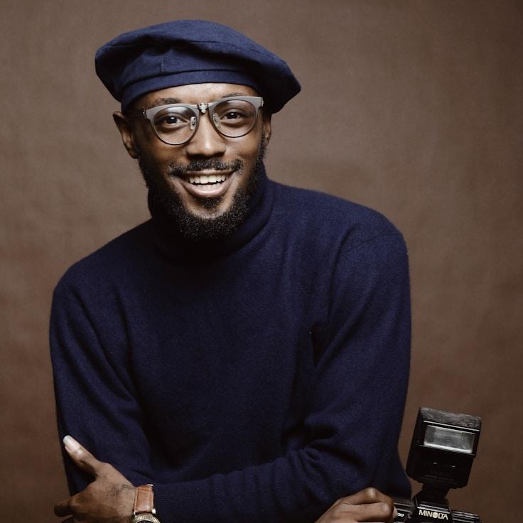 Anya Verma, Lead Design Curator at Adaptive Know Ledge Framework, reviewing corporate floral arrangements